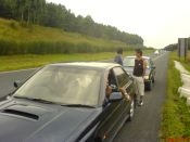 
  Group of Siz in two cars, waiting for Asim to finish...